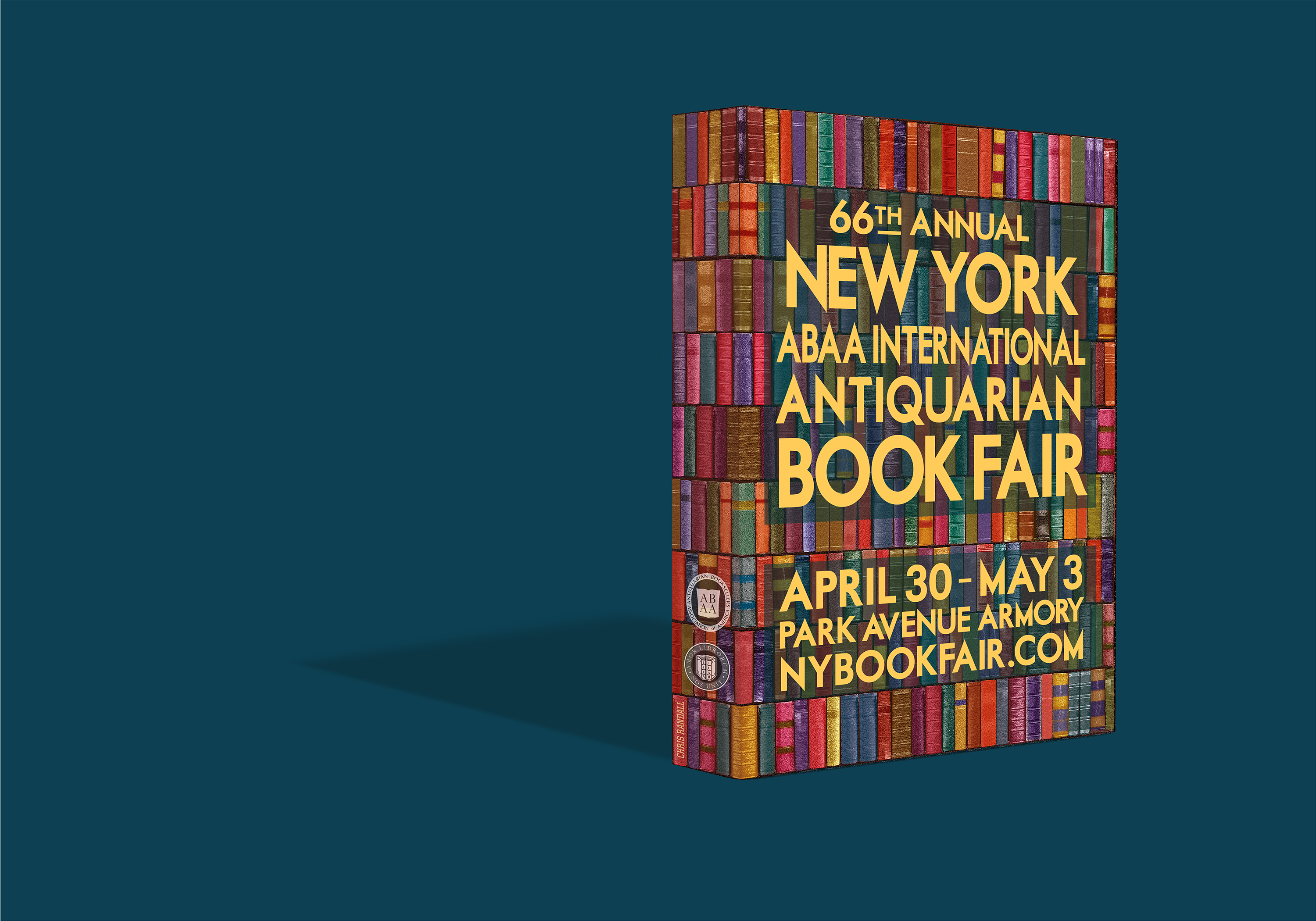 The image features a promotional poster for the 66th Annual New York Antiquarian Book Fair. The poster is designed to resemble the spine of a large, colorful stack of books, arranged in a grid pattern. Each book spine is a different color, creating a vibrant mosaic effect. The text is prominently displayed in large, bold yellow letters that contrast against the multicolored background of book spines. The left side of the image includes two circular logos. The background is a solid teal color, and the poster is positioned at an angle, giving it a three-dimensional appearance.