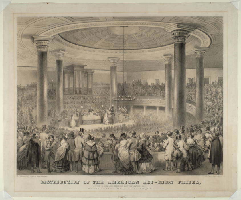 Black and white print of a large, domed, circular hall filled with spectators observing the distribution of prizes. In the background is a large pipe organ and a variety of gas lighting devices.